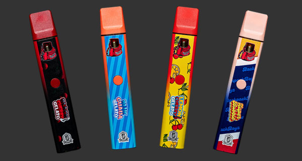 four colorful vape pens displayed on a dark background featuring various flavors and designs including gelato and fruit with vibrant packaging showcasing 5 unique features